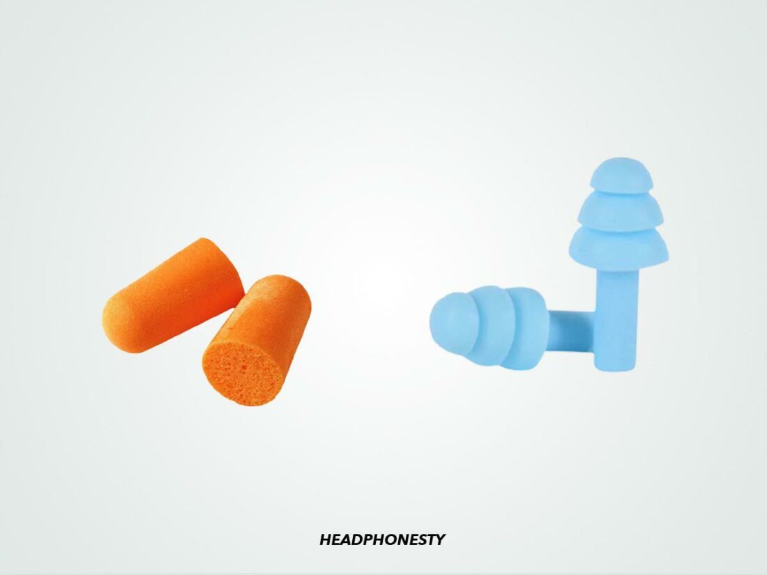Two pairs of different types of earplugs.