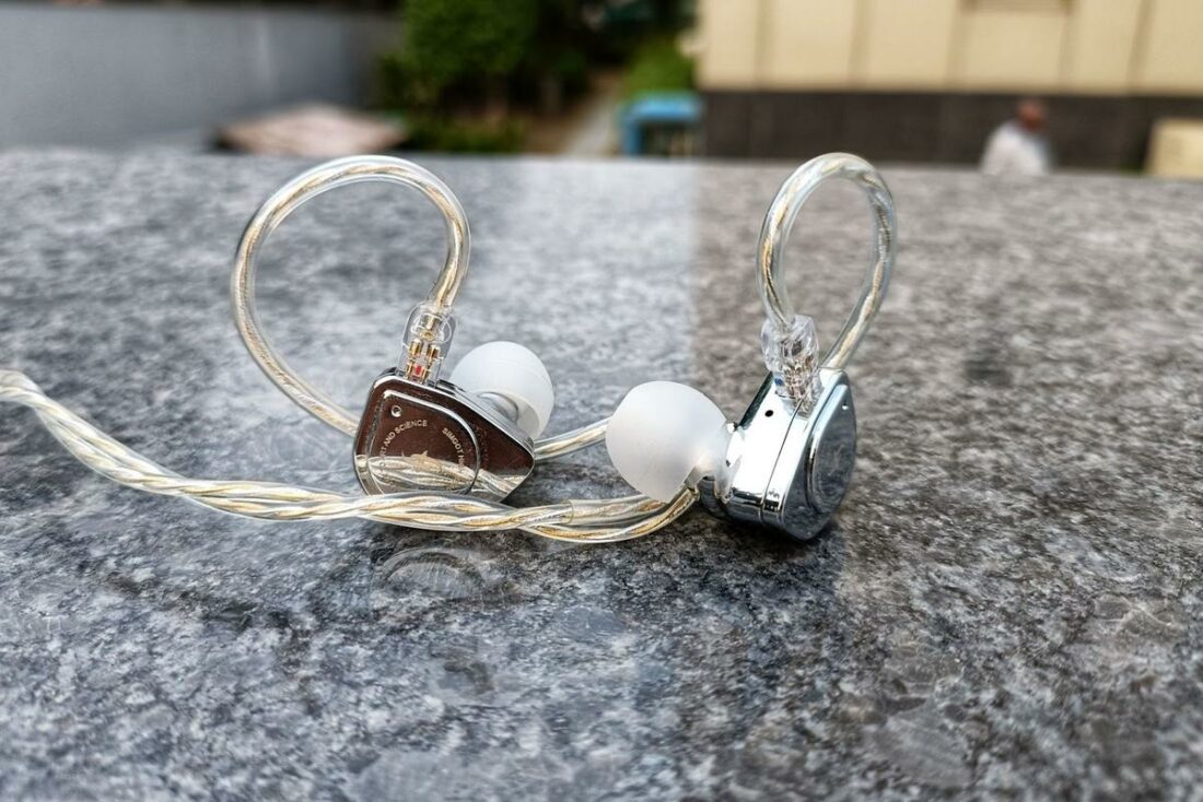 The highly polished surface of the earpieces reflects like a mirror.